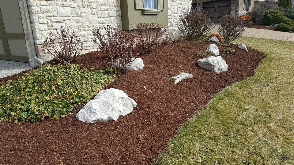 Laying mulch and landscaping rock in Springfield.